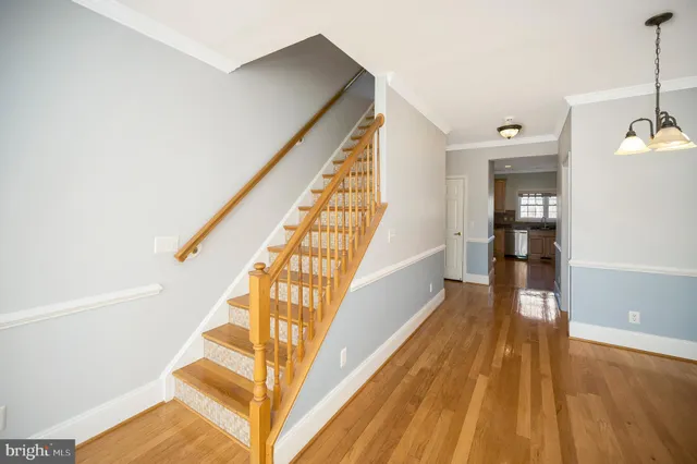 a bathroom with a granite countertop toilet sink and mirror
