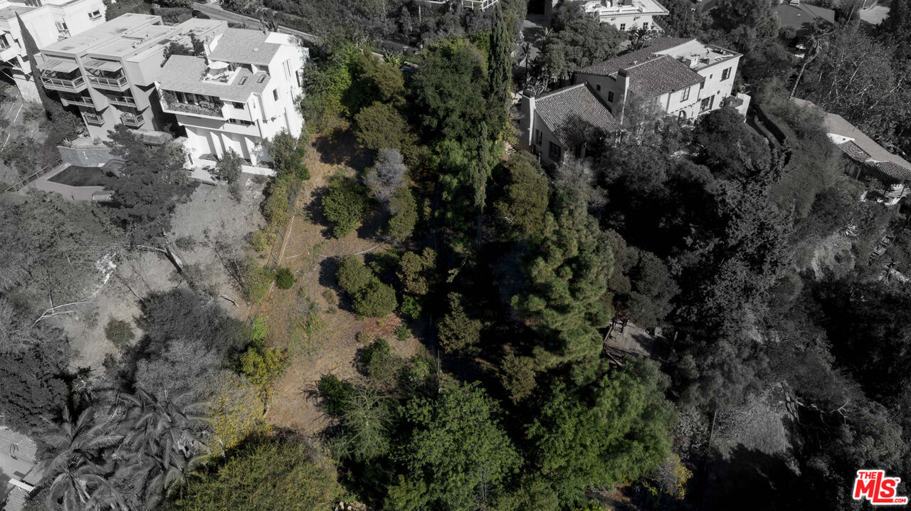 1579 Lindacrest Drive Beverly Hills, CA 90210 - Photo 2 of 2 a aerial view of residential house with parking space and trees
