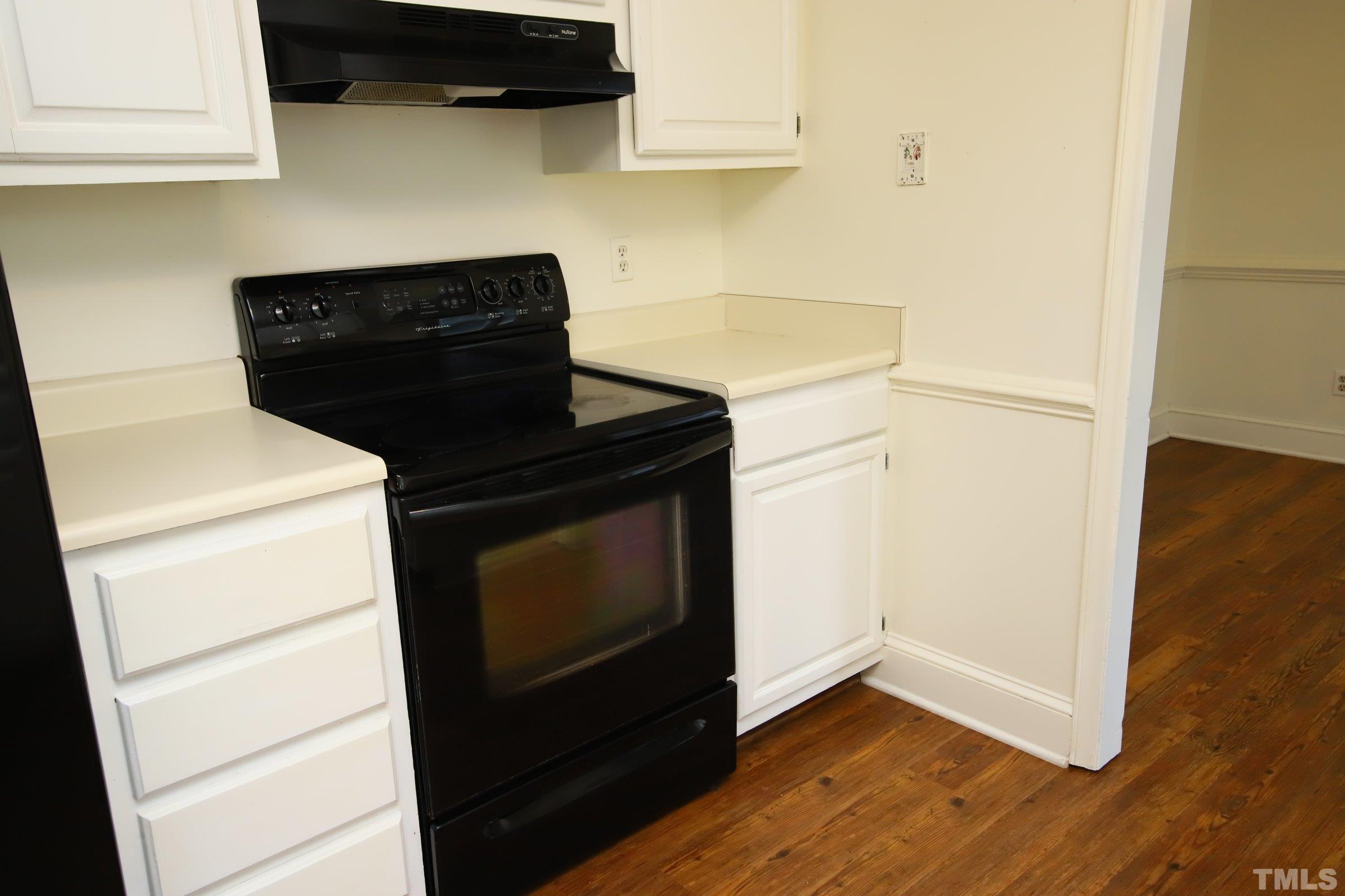 4224 Bluewing Road Raleigh, NC 27616 - Photo 11 of 29 a stove top oven sitting inside of a kitchen