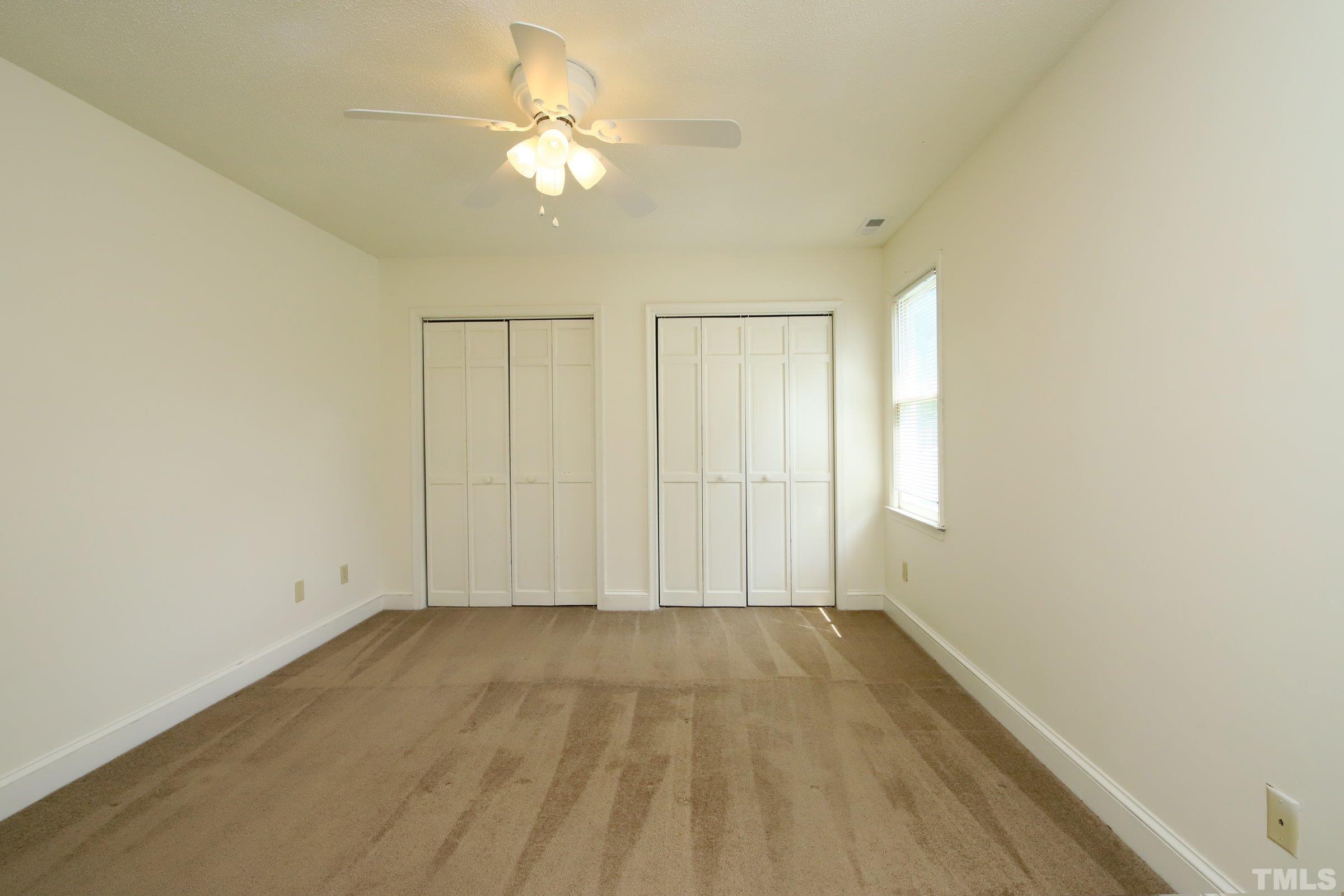 4224 Bluewing Road Raleigh, NC 27616 - Photo 17 of 29 wooden floor in an empty room with a window