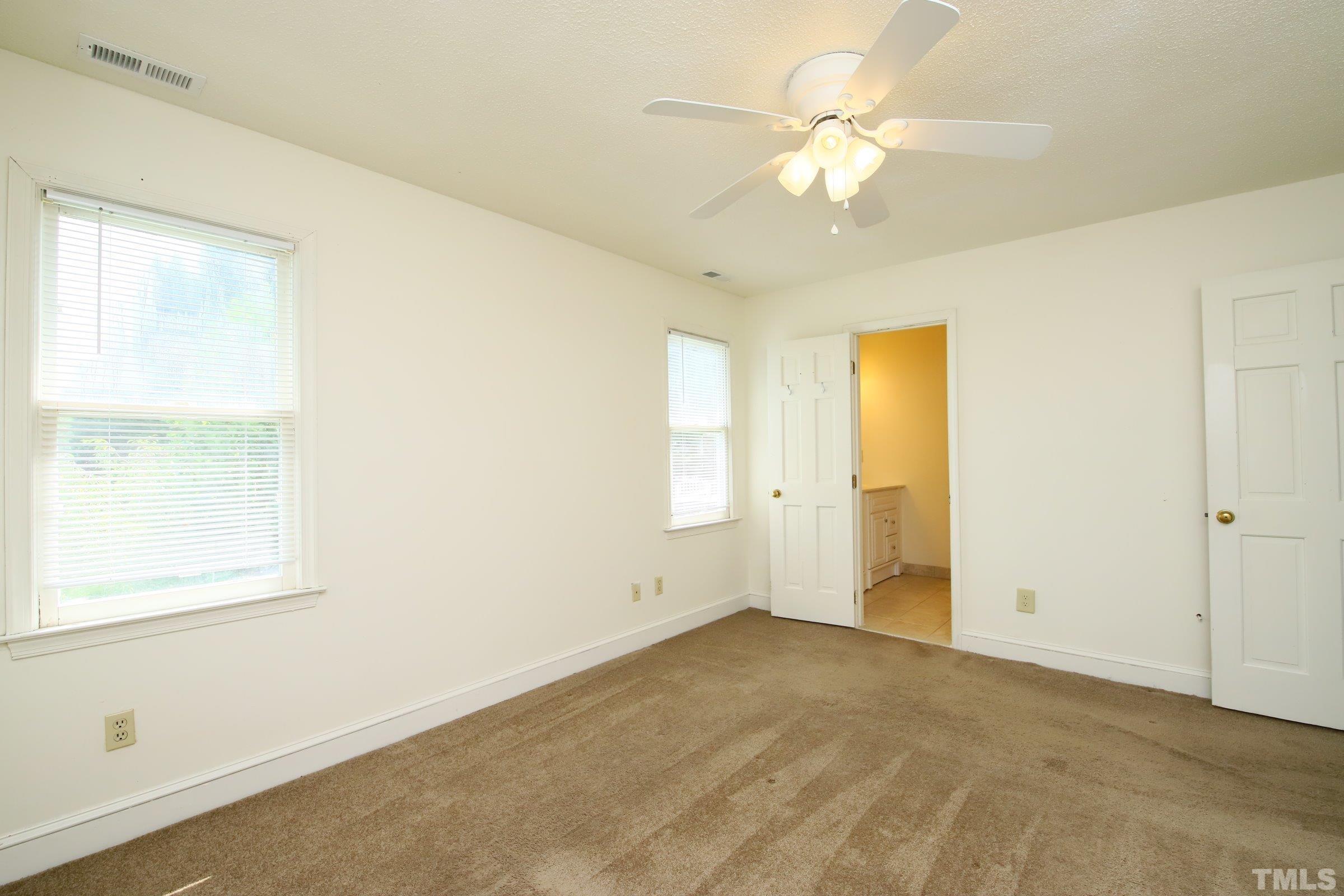 4224 Bluewing Road Raleigh, NC 27616 - Photo 18 of 29 a view of an empty room with a window