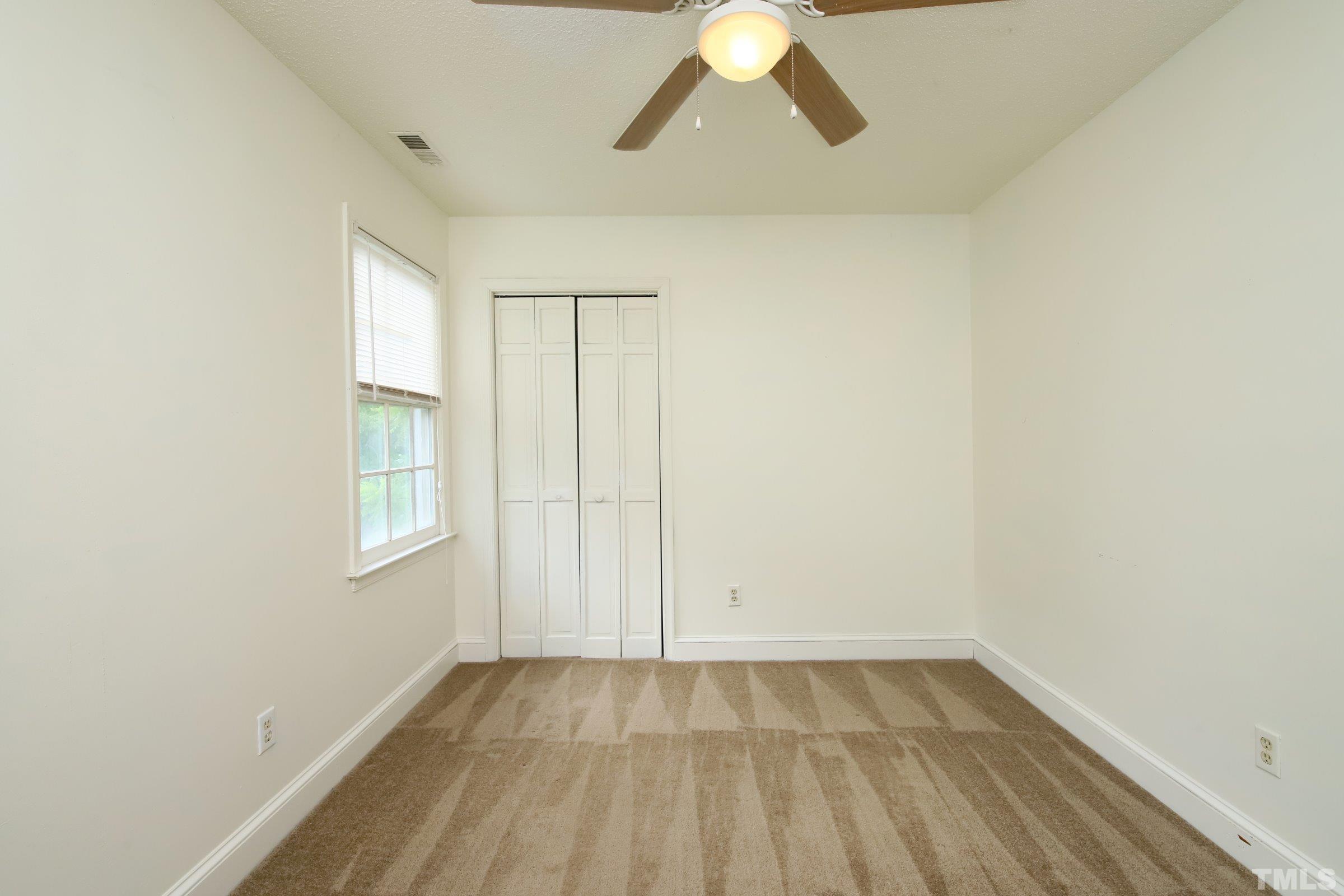 4224 Bluewing Road Raleigh, NC 27616 - Photo 21 of 29 an empty room with a window