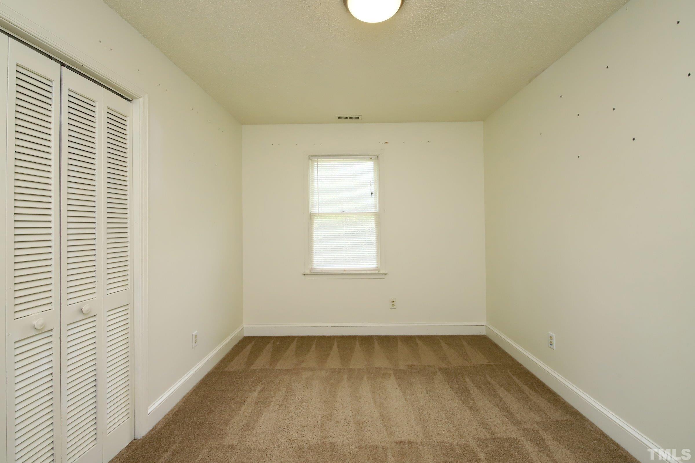 4224 Bluewing Road Raleigh, NC 27616 - Photo 22 of 29 an empty room with a window