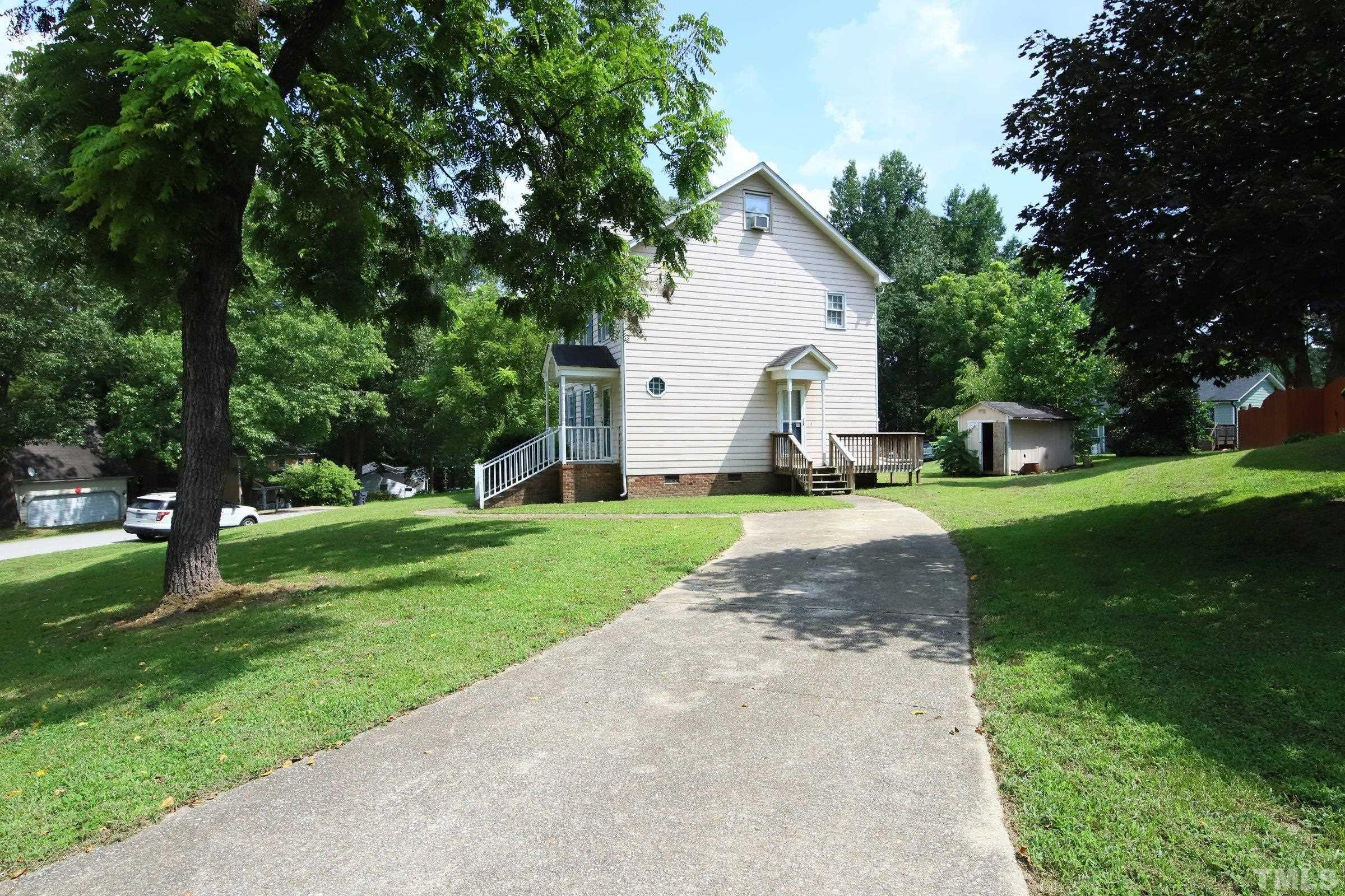 4224 Bluewing Road Raleigh, NC 27616 - Photo 27 of 29 a view of a house with a yard