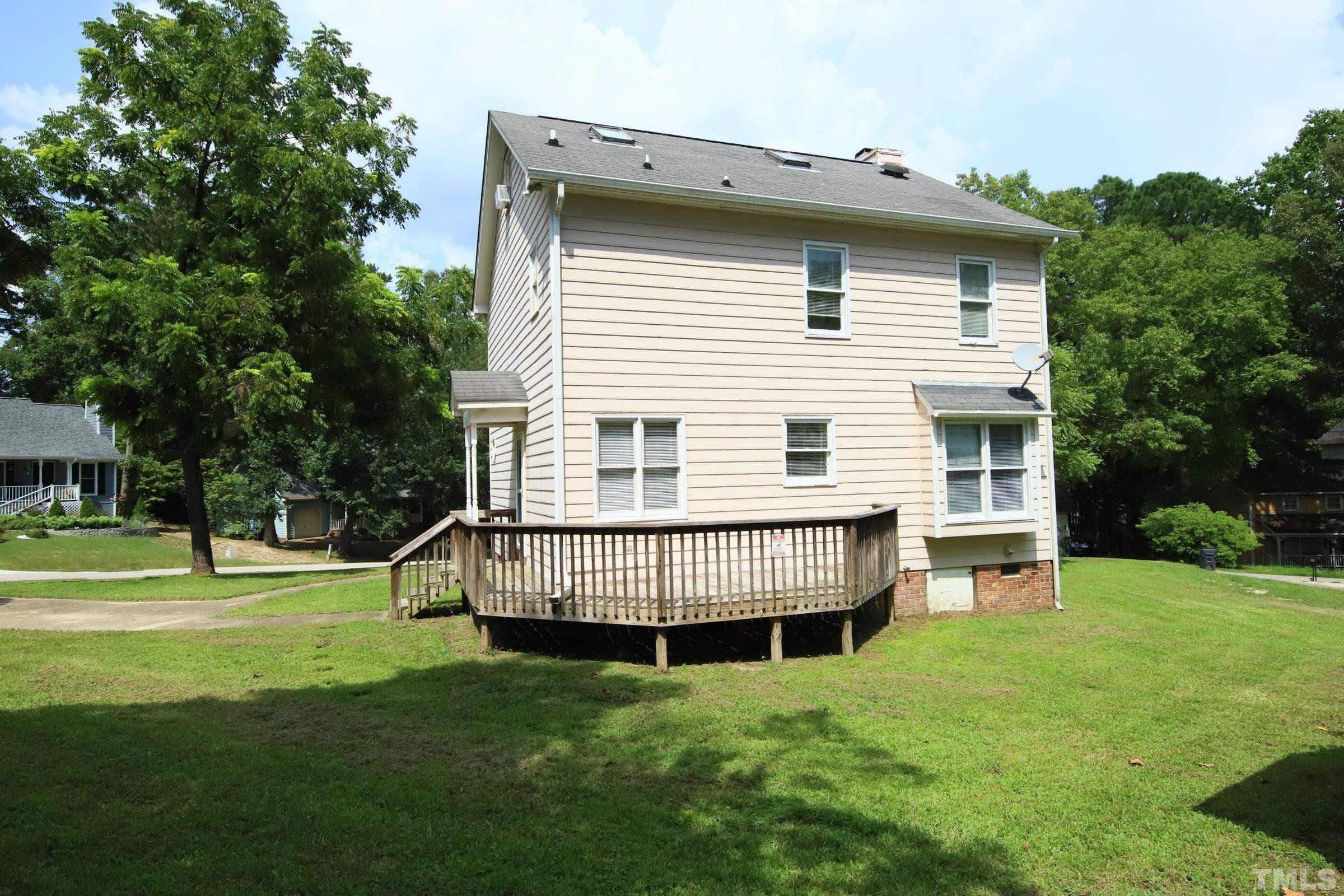 4224 Bluewing Road Raleigh, NC 27616 - Photo 28 of 29 a view of a house with a yard and sitting area