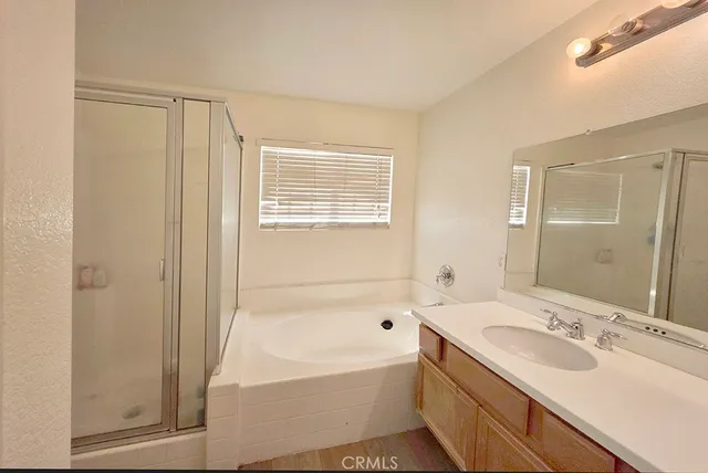a bathroom with a toilet a sink and shower