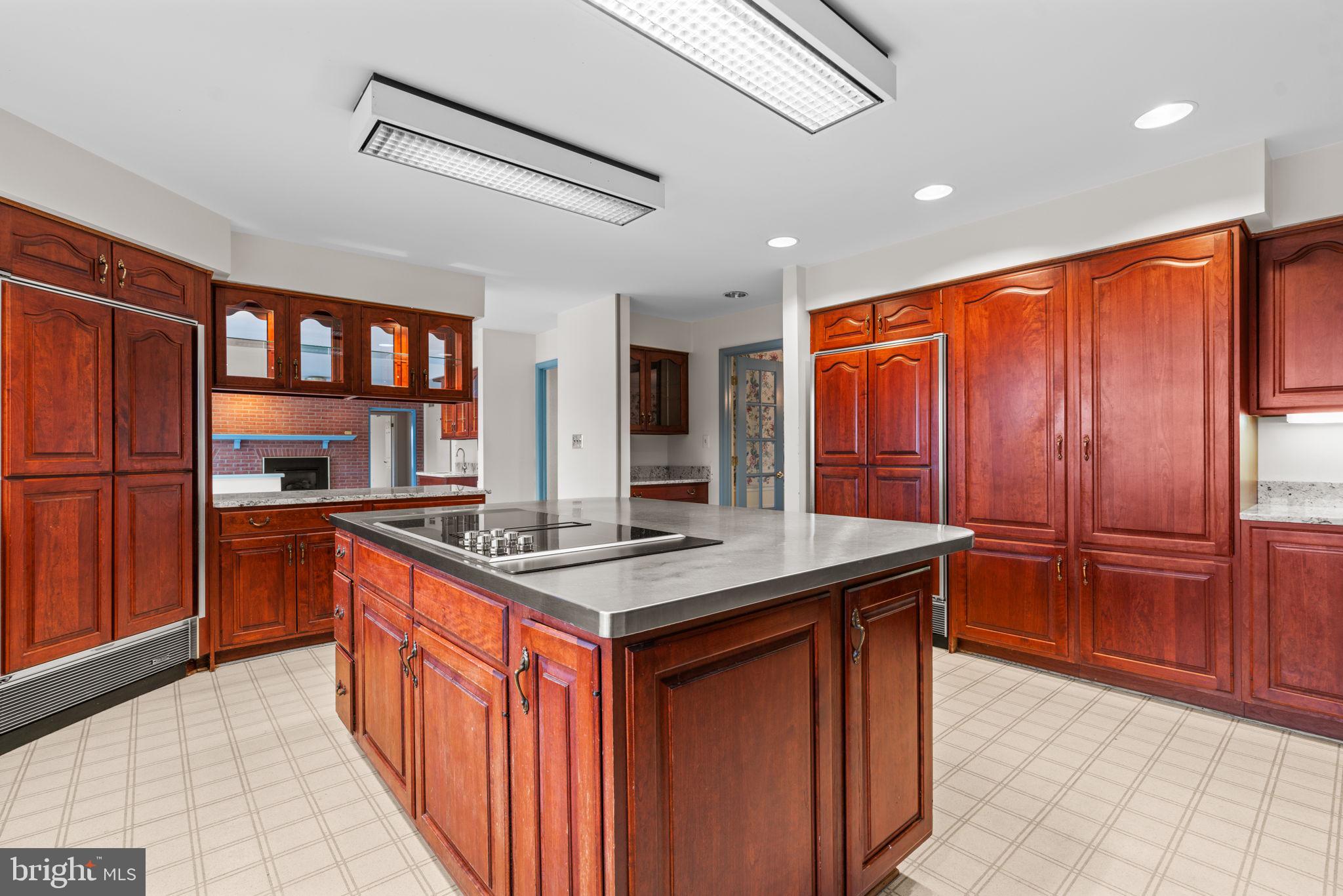 6005 Ten Oaks Road Clarksville, MD 21029 - Photo 45 of 86 a kitchen with stainless steel appliances granite countertop a stove refrigerator and cabinets
