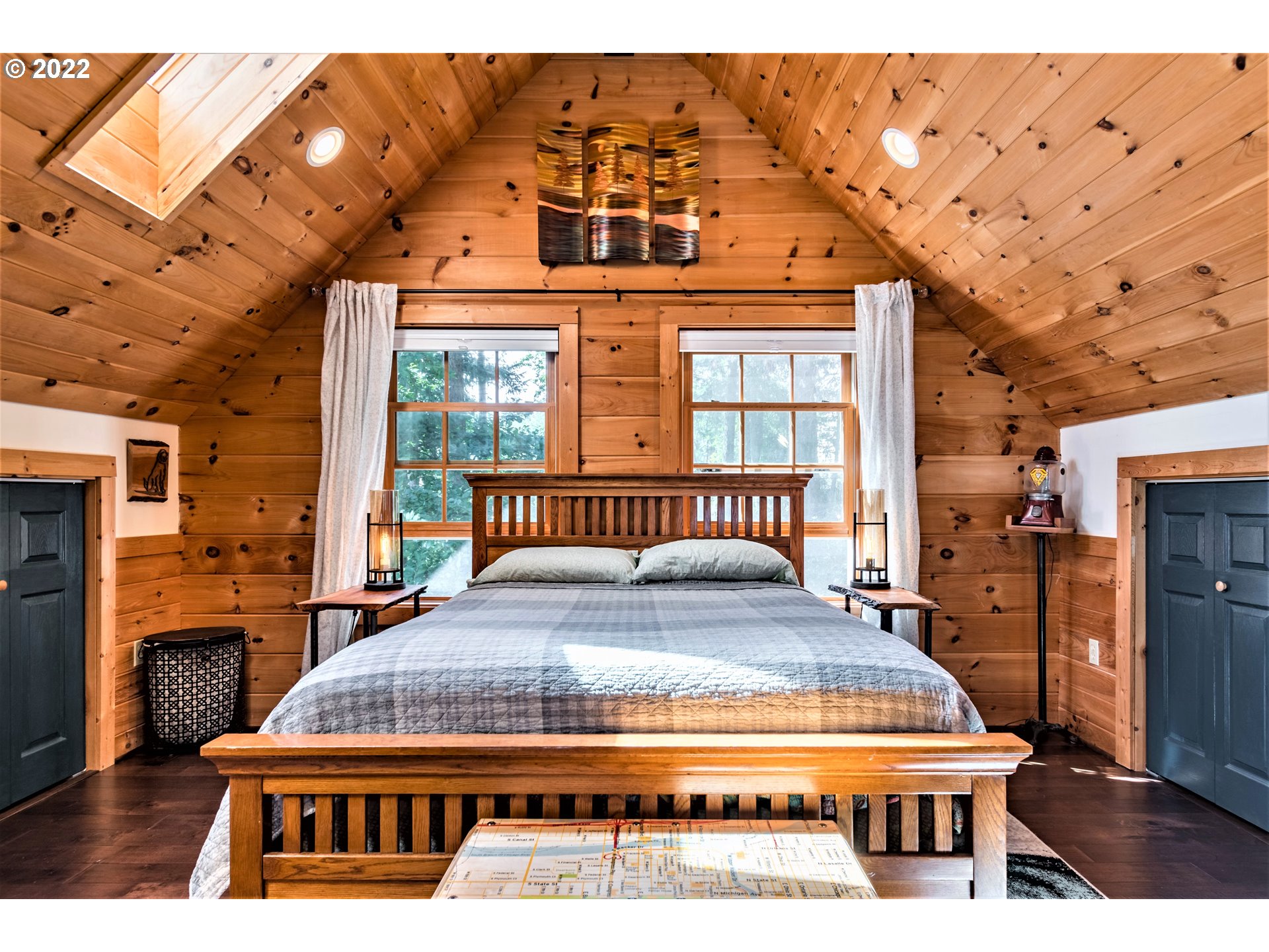 3330 Videra Drive Eugene, OR 97405 - Photo 17 of 32 a living room with a bed a flat tv screen and dresser