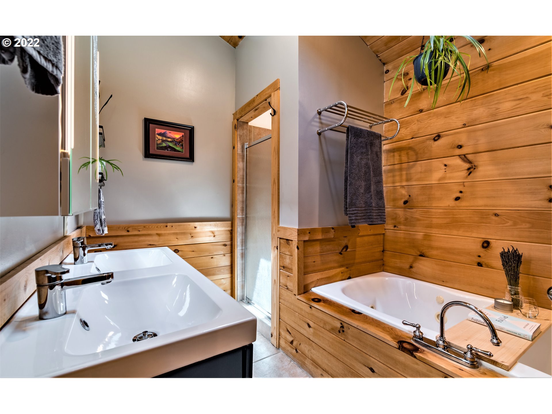 3330 Videra Drive Eugene, OR 97405 - Photo 20 of 32 a bathroom with a tub sink and mirror