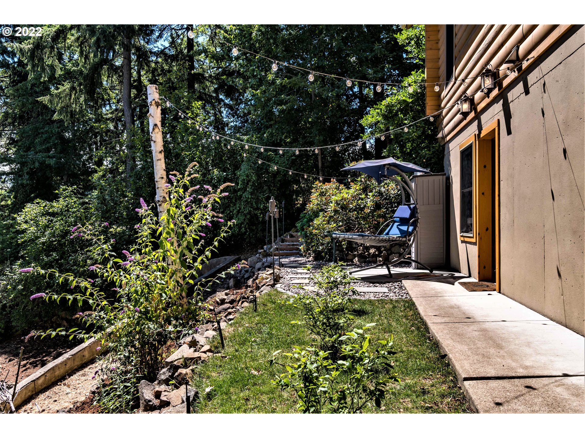 3330 Videra Drive Eugene, OR 97405 - Photo 28 of 32 a backyard of a house with yard and outdoor seating