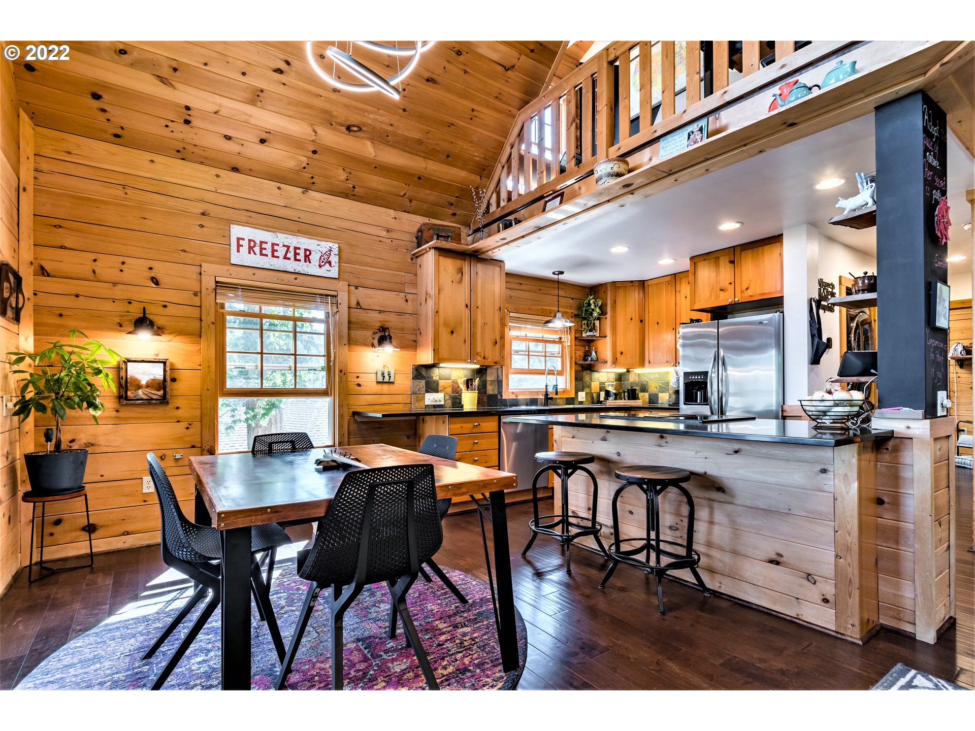 3330 Videra Drive Eugene, OR 97405 - Photo 7 of 32 a view of a dining area with furniture and a chandelier