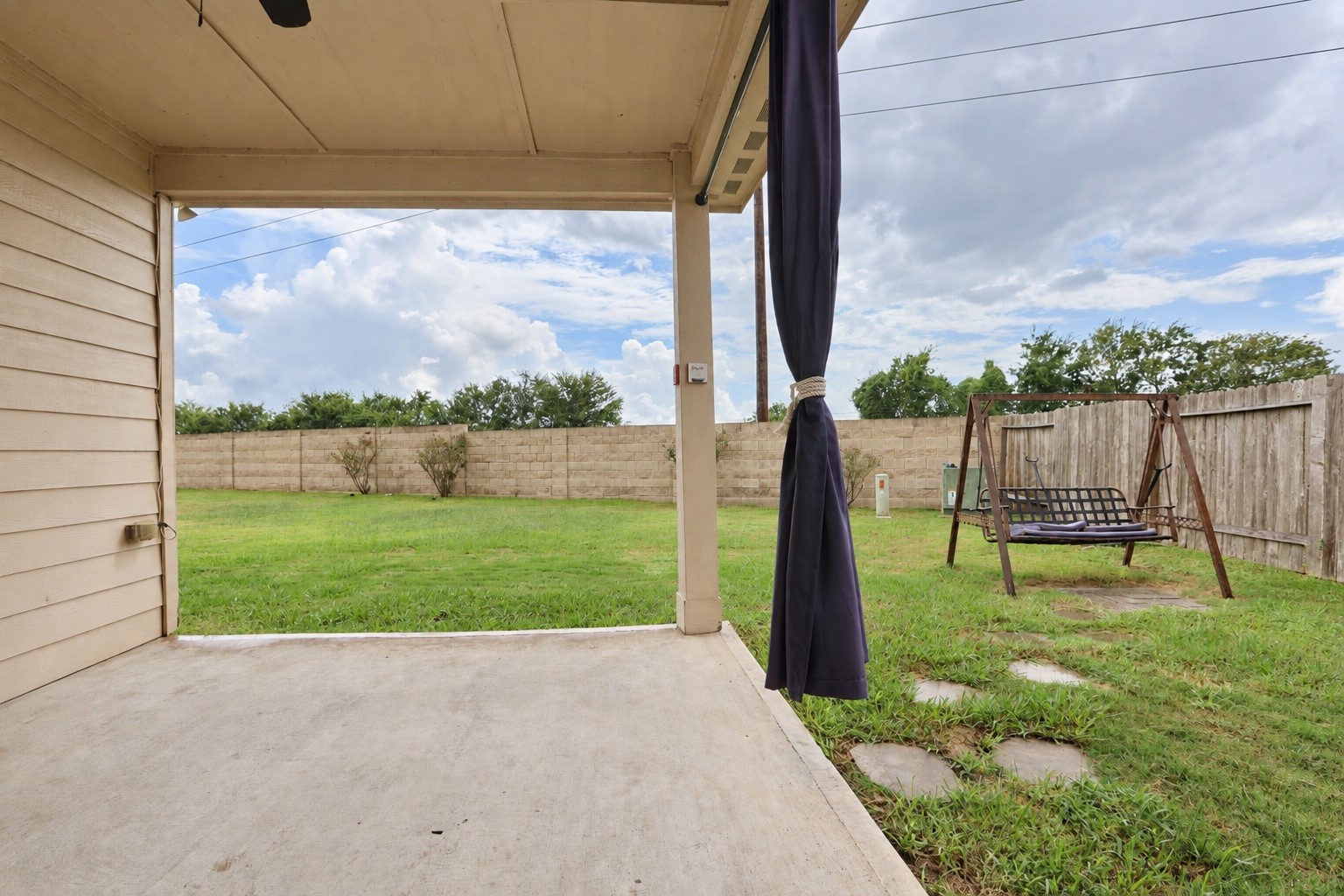 1634 Pink Stone Drive Rosharon, TX 77583 - Photo 16 of 38 One if the nicer features of this home is the covered patio, situated at a corner angle so you can make room for a playground or a future pool!