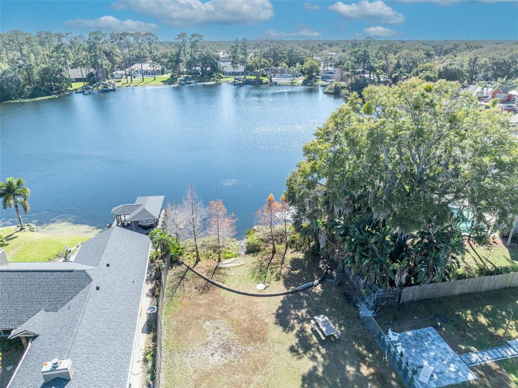 4234 Kendrick Road Orlando, FL 32804 - Photo 46 of 46 an aerial view of a house with a yard and lake view