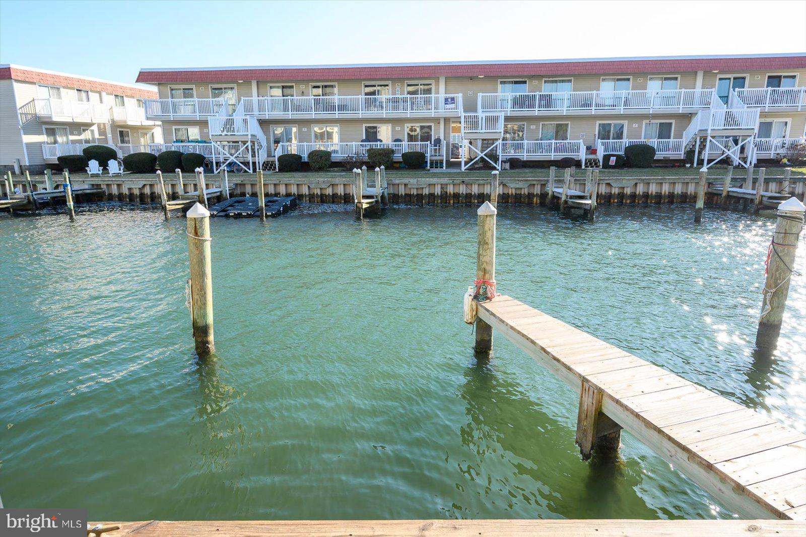 609 Dory Road, Unit 304 Ocean City, MD 21842 - Photo 11 of 55 a view of swimming pool with outdoor seating and yard