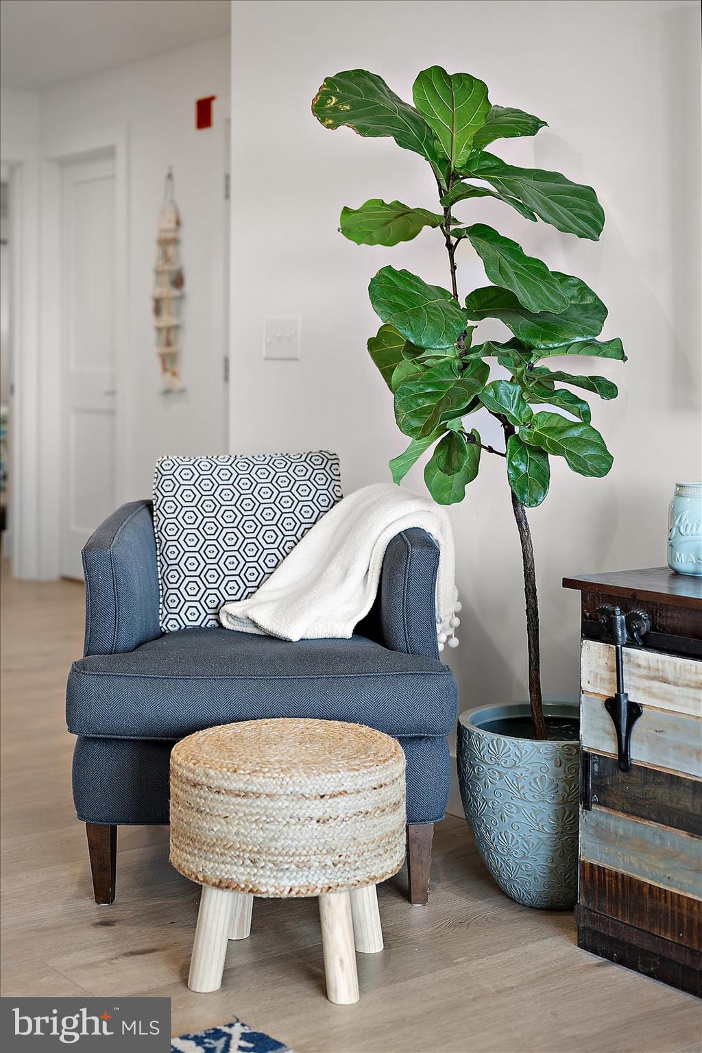 609 Dory Road, Unit 304 Ocean City, MD 21842 - Photo 13 of 55 a living room with furniture and a potted plant