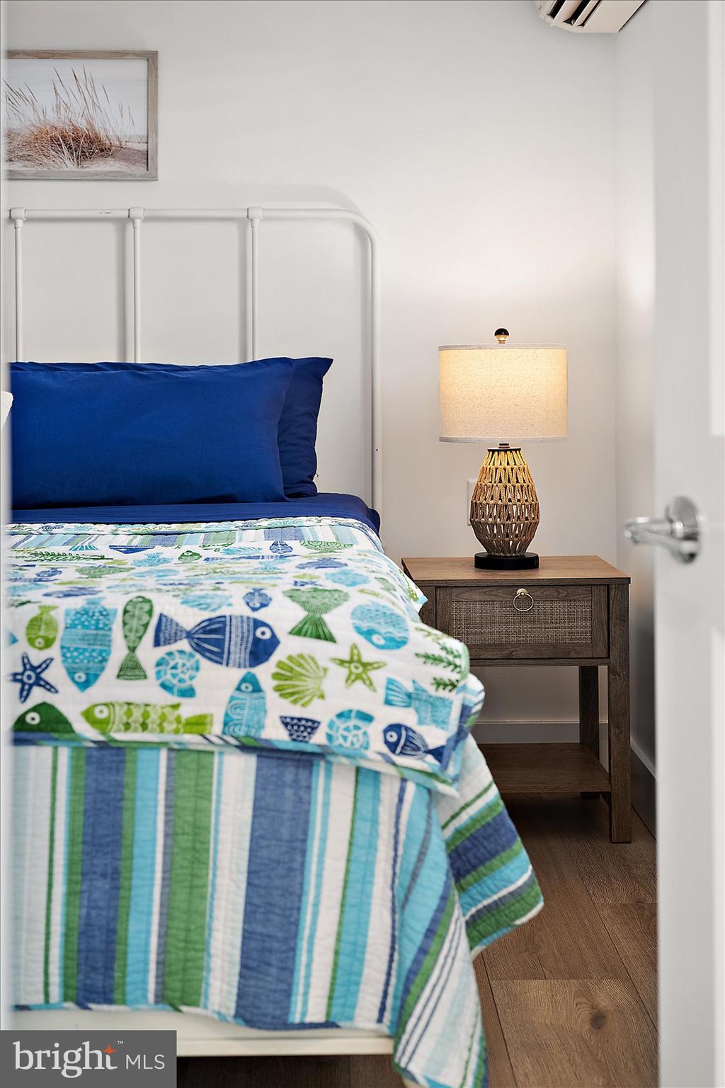 609 Dory Road, Unit 304 Ocean City, MD 21842 - Photo 26 of 55 a bedroom with a bed and toys
