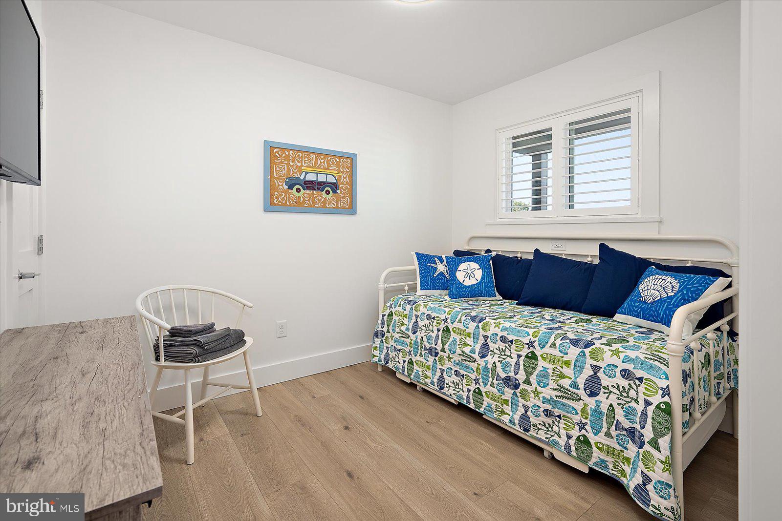 609 Dory Road, Unit 304 Ocean City, MD 21842 - Photo 36 of 55 a bedroom with a bed and a window