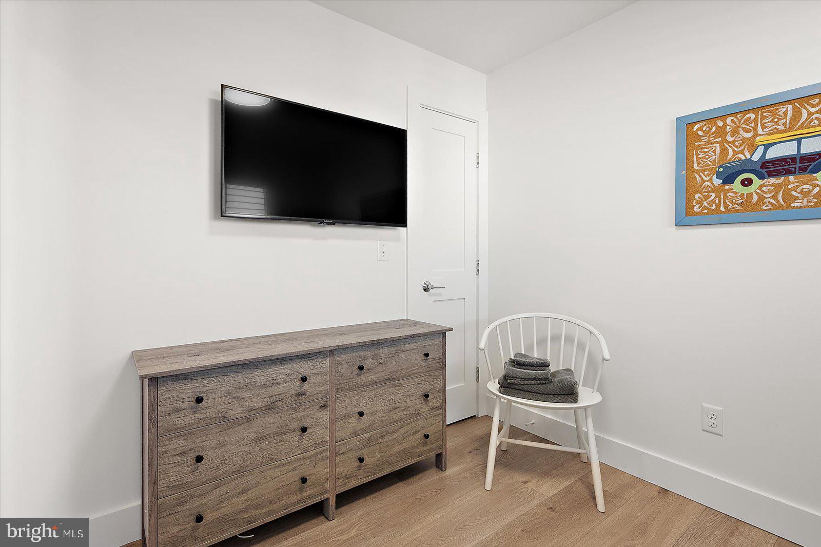609 Dory Road, Unit 304 Ocean City, MD 21842 - Photo 37 of 55 a living room with furniture and a flat screen tv