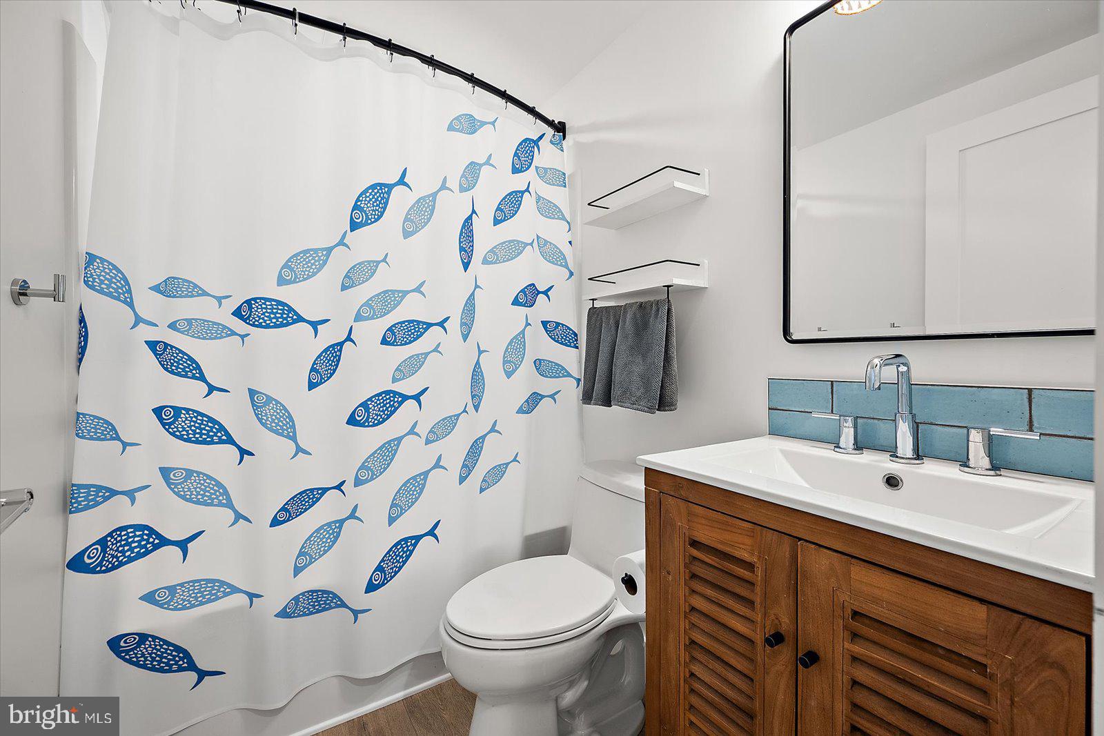 609 Dory Road, Unit 304 Ocean City, MD 21842 - Photo 40 of 55 a bathroom with a sink and a mirror