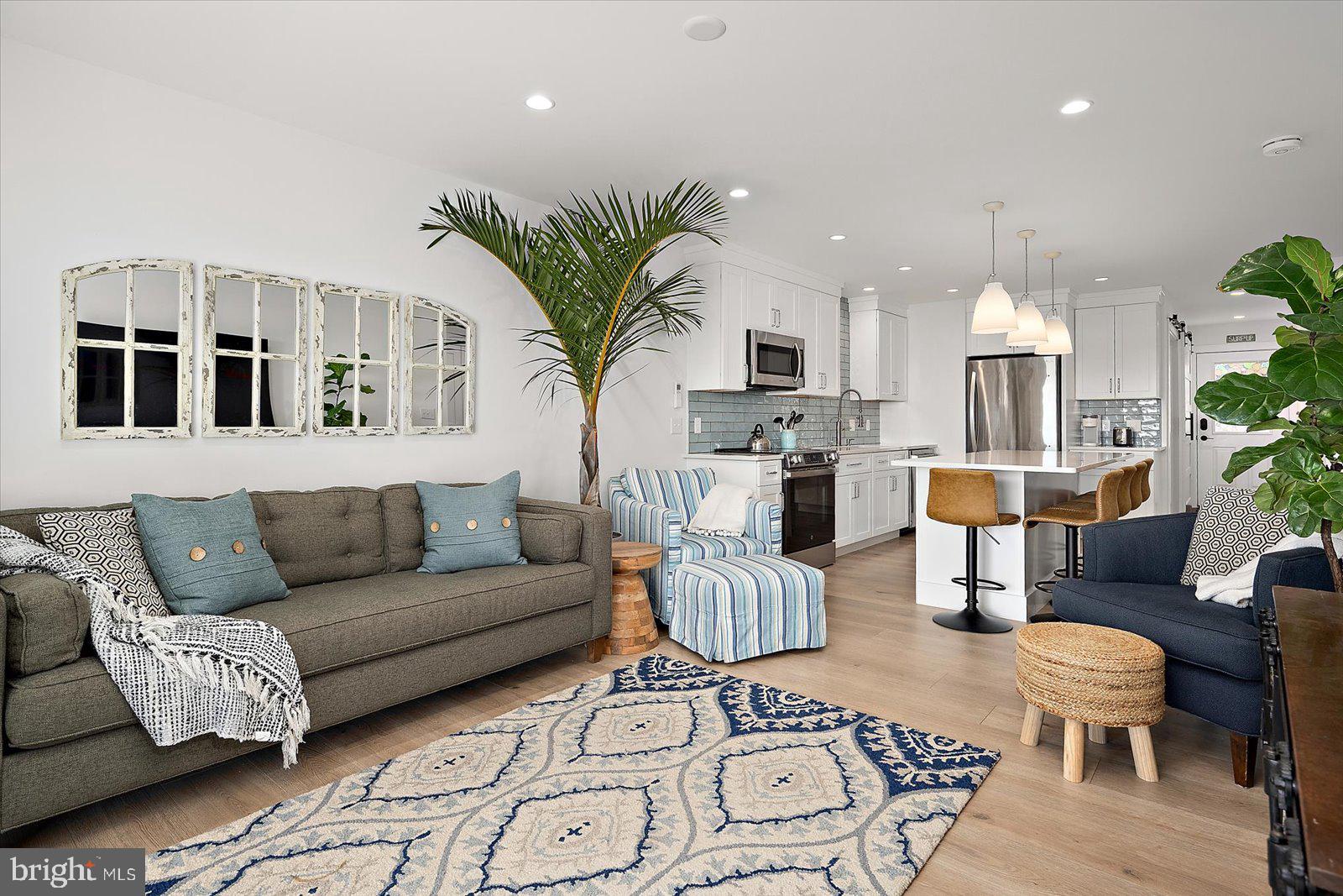 609 Dory Road, Unit 304 Ocean City, MD 21842 - Photo 4 of 55 a living room with furniture kitchen and a potted plant