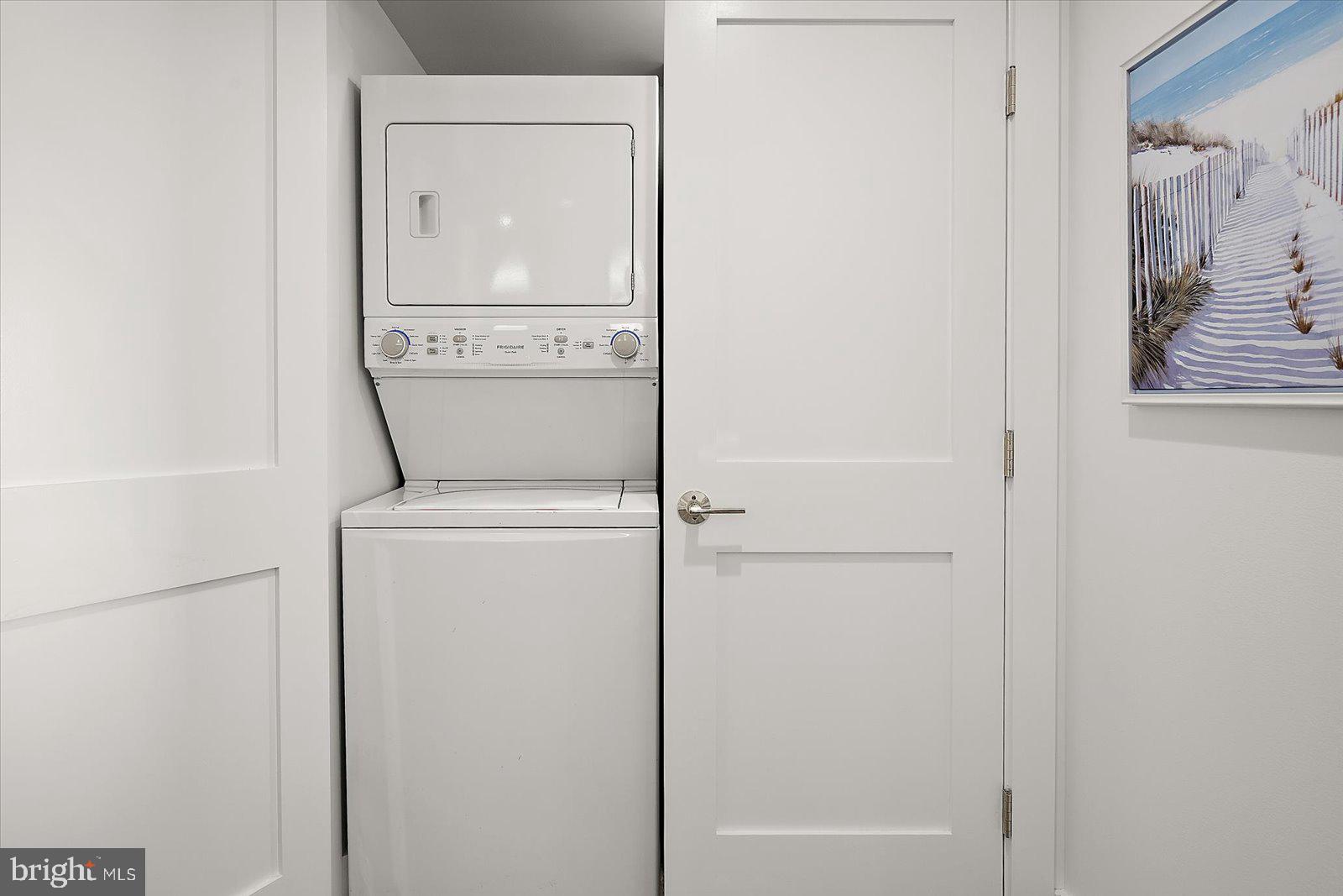 609 Dory Road, Unit 304 Ocean City, MD 21842 - Photo 41 of 55 a utility room with dryer and washer