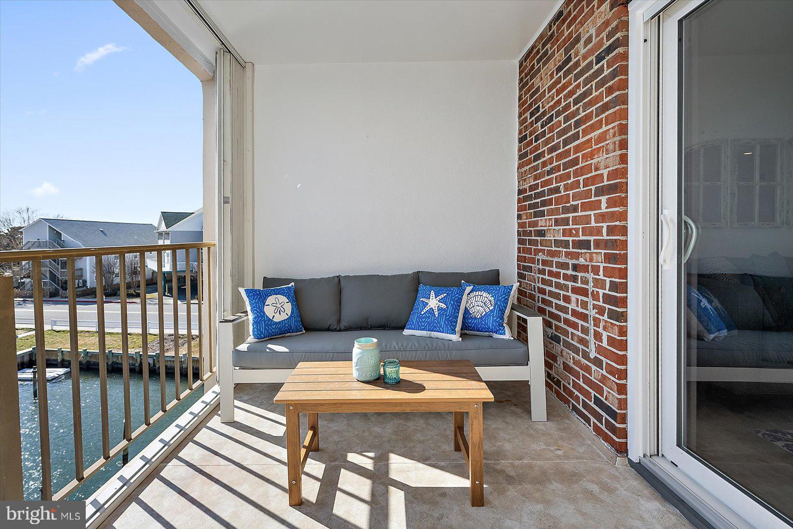 609 Dory Road, Unit 304 Ocean City, MD 21842 - Photo 49 of 55 a outdoor living with furniture and a rug