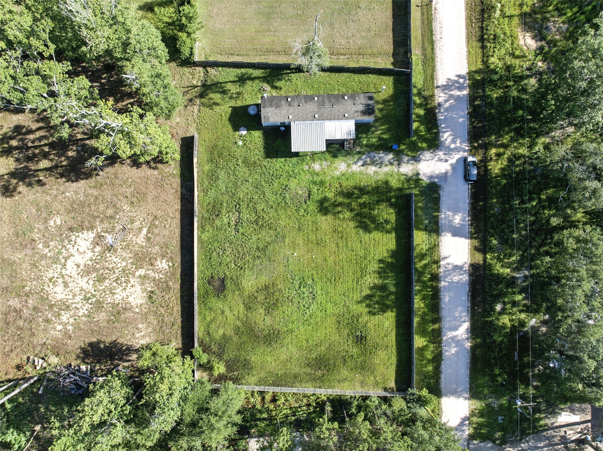91 Maple Lane Shepherd, TX 77371 - Photo 11 of 15 an aerial view of a house with a garden