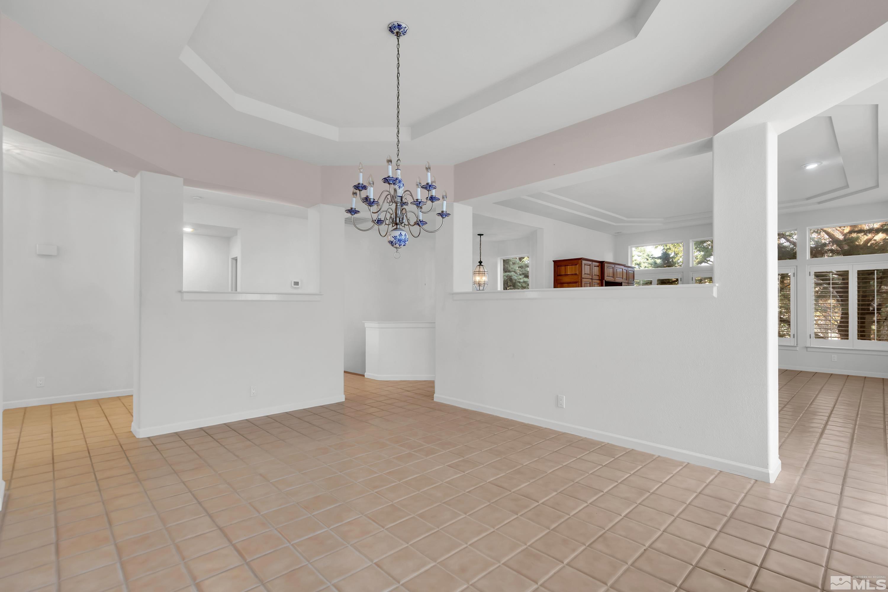 3865 Chinook Creek Road Reno, NV 89519 - Photo 9 of 40 a view of a room with chandelier and refrigerator