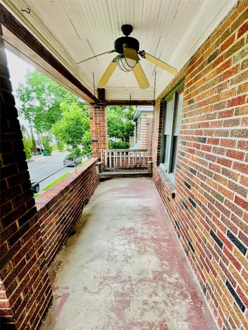 a view of a back yard from a balcony