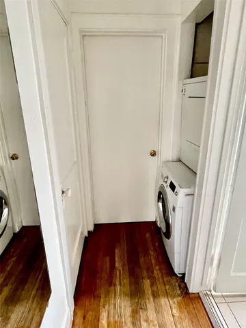 a view of front door with wooden floor