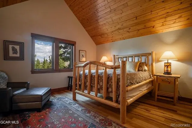 a bedroom with furniture and a window