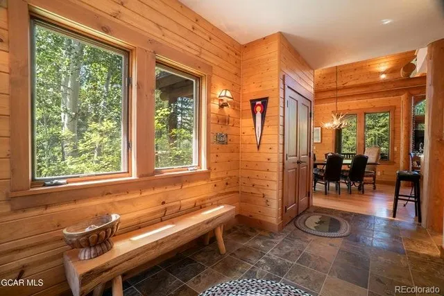 a indoor patio with swimming pool and outdoor seating