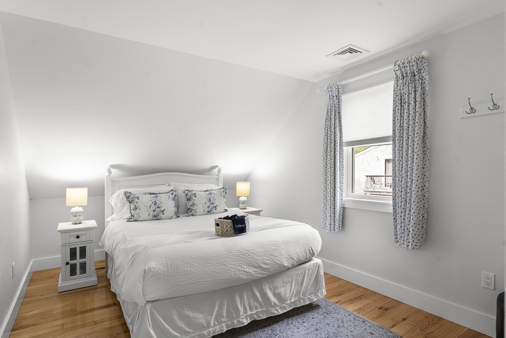 4 Hye Lane Edgartown, MA 02539 - Photo 33 of 41 a bedroom with a bed and window