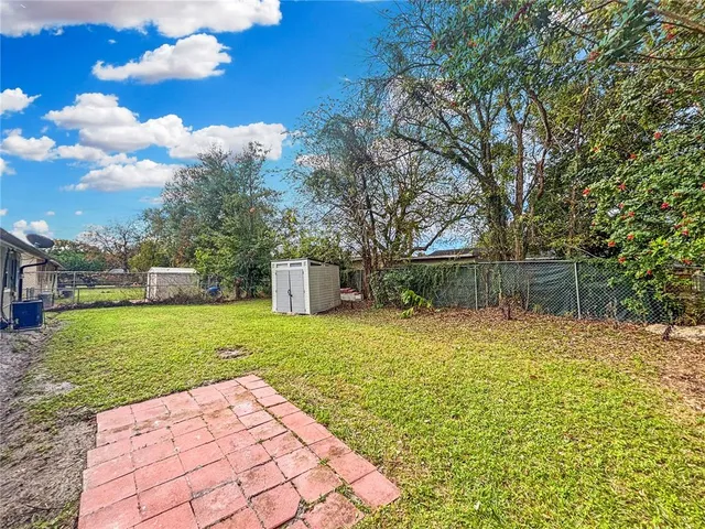 a backyard of a house with lots of green space