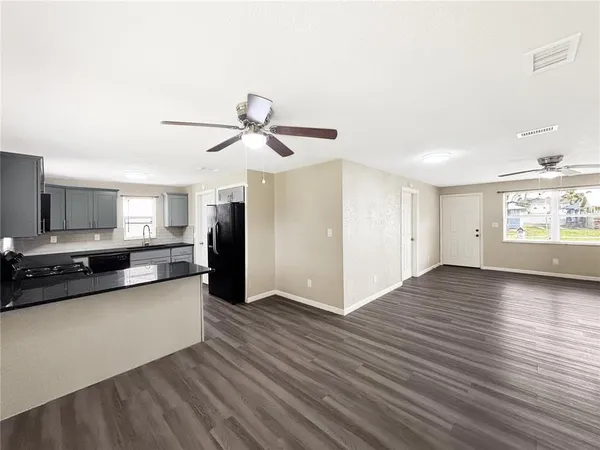 a view of a kitchen with a sink and a window
