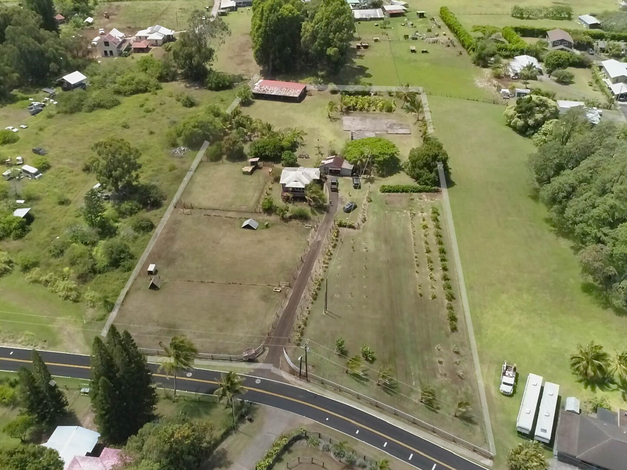 an aerial view of a residential houses with outdoor space