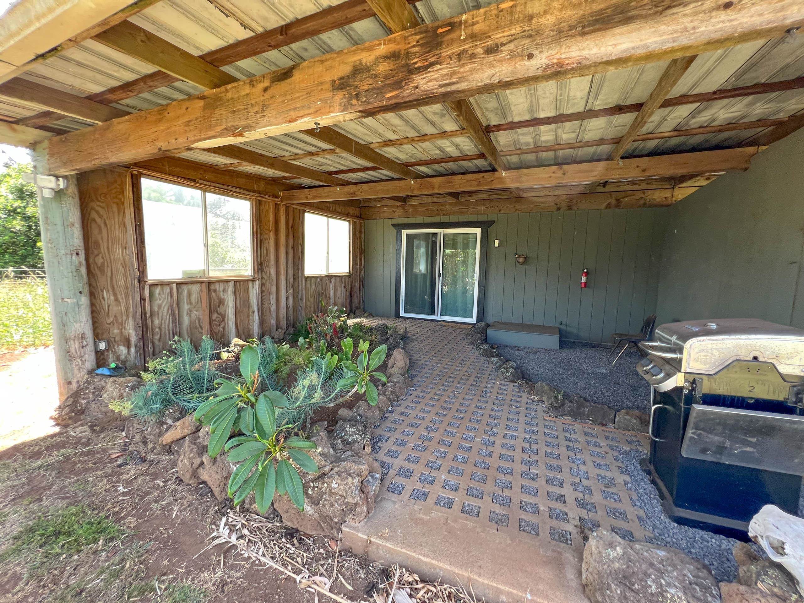2594 Puuomalei Road Haiku, HI 96708 - Photo 20 of 30 a house view with a backyard space