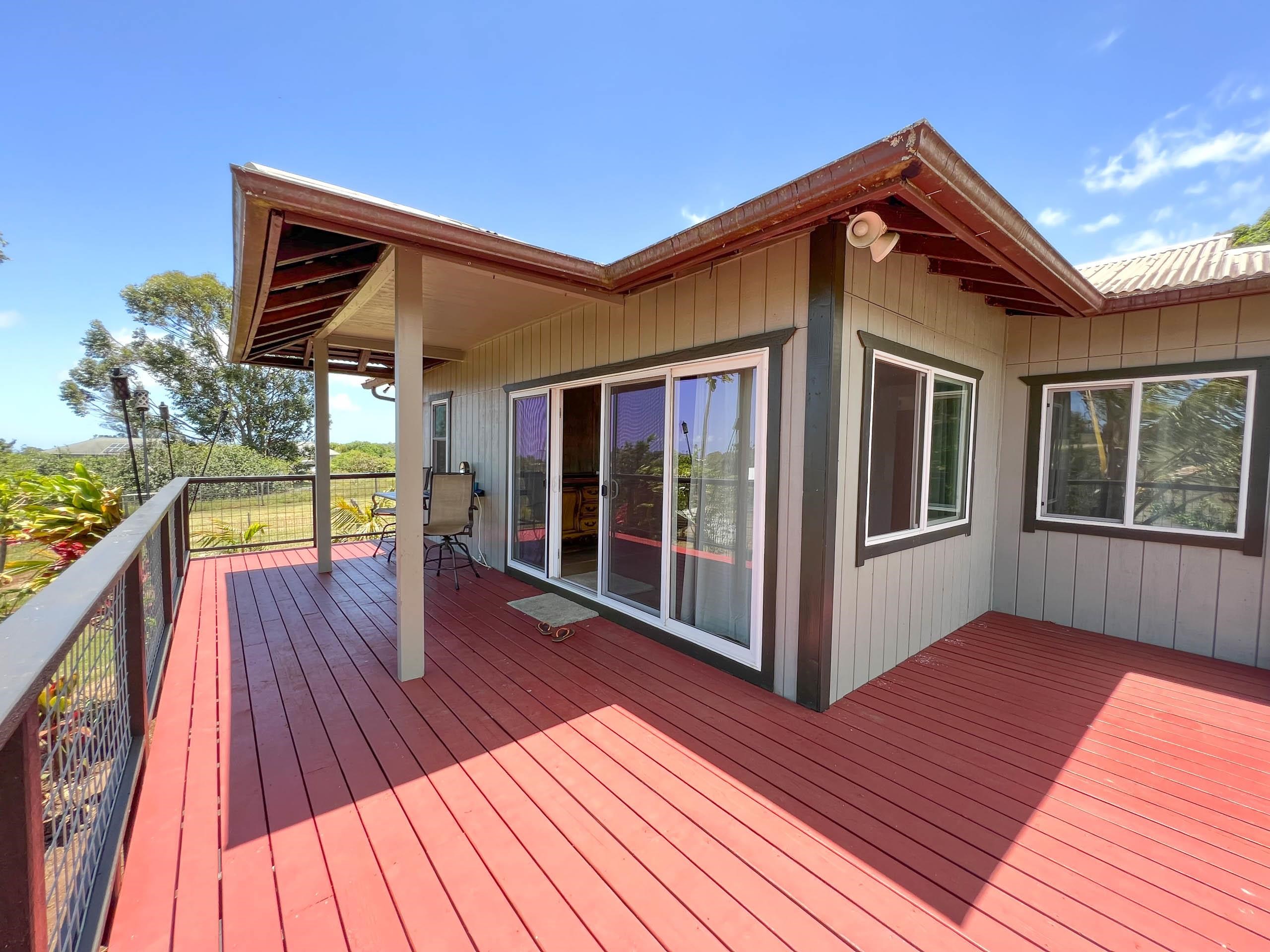 2594 Puuomalei Road Haiku, HI 96708 - Photo 6 of 30 a view of wooden house with a wooden floor and a window