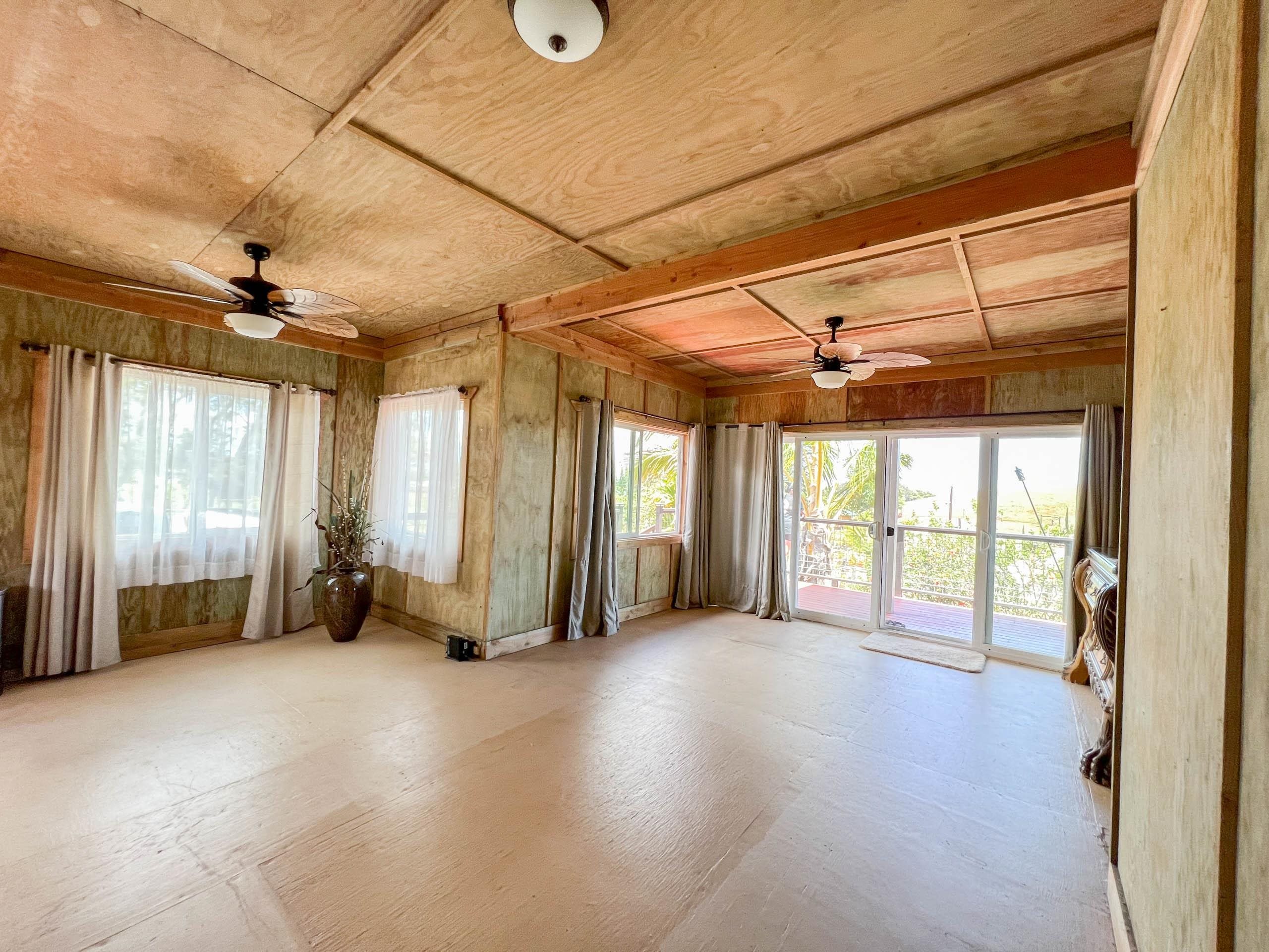 2594 Puuomalei Road Haiku, HI 96708 - Photo 9 of 30 a view of empty room with wooden floor