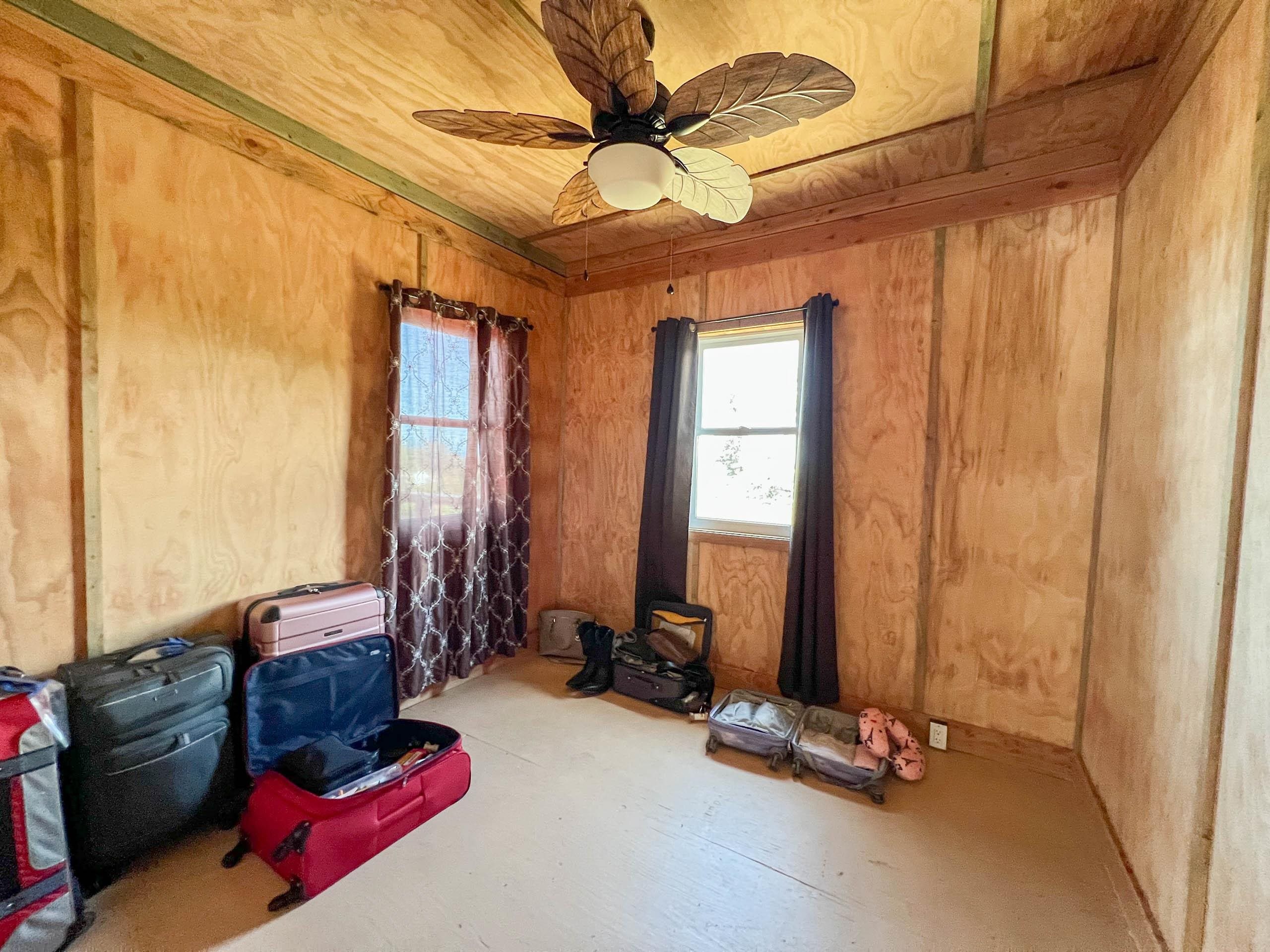 2594 Puuomalei Road Haiku, HI 96708 - Photo 10 of 30 a room with gym equipment and large windows