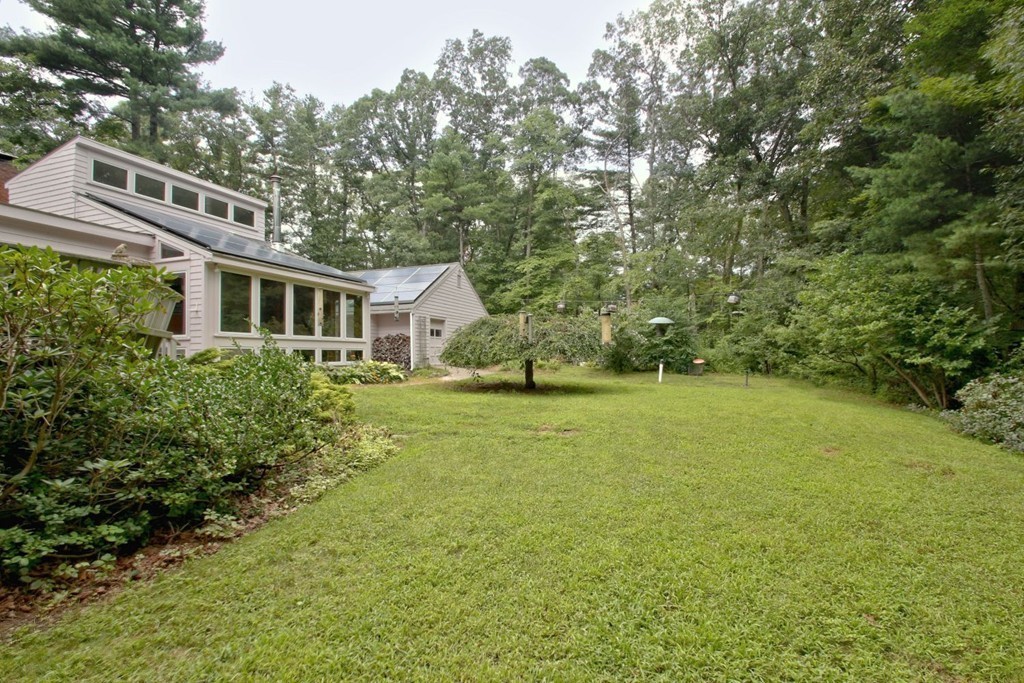 62 Maynard Road Sudbury, MA 01776 - Photo 29 of 30 a view of a house with backyard and garden