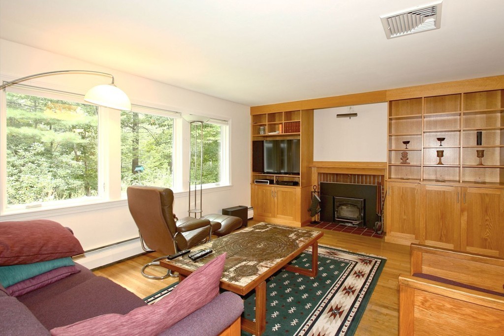 62 Maynard Road Sudbury, MA 01776 - Photo 4 of 30 a living room with furniture fireplace and a table
