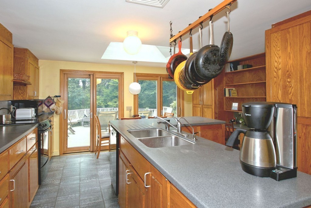 62 Maynard Road Sudbury, MA 01776 - Photo 5 of 30 a kitchen with a large window and a sink