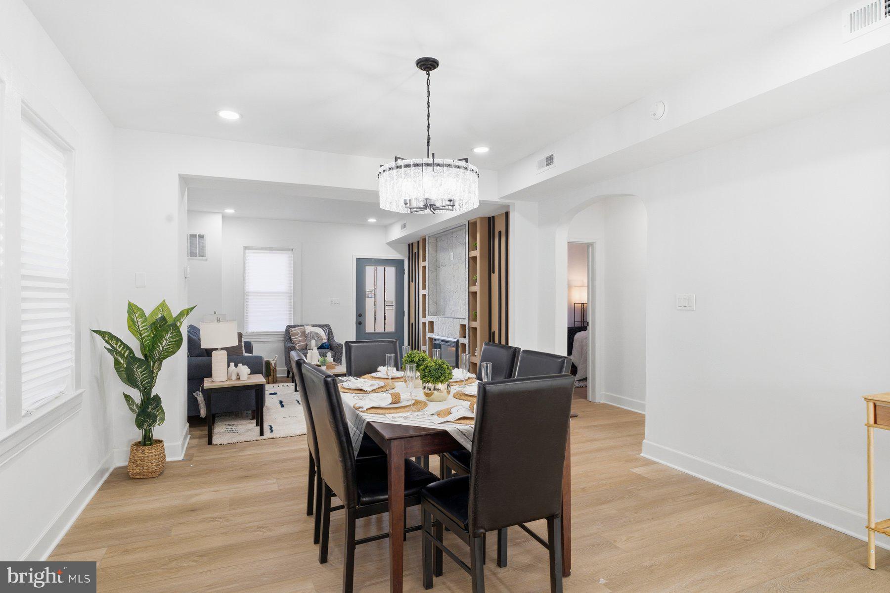 413 1st Avenue Halethorpe, MD 21227 - Photo 10 of 38 a view of a dining room with furniture and wooden floor