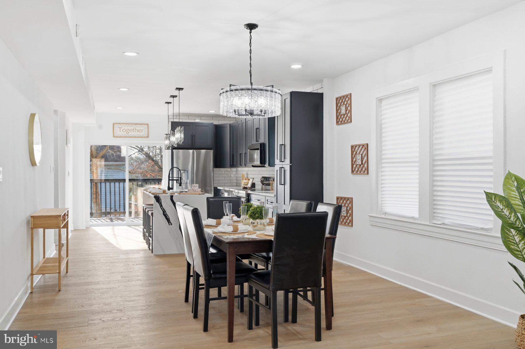 413 1st Avenue Halethorpe, MD 21227 - Photo 12 of 38 a view of a dining room with furniture window and wooden floor