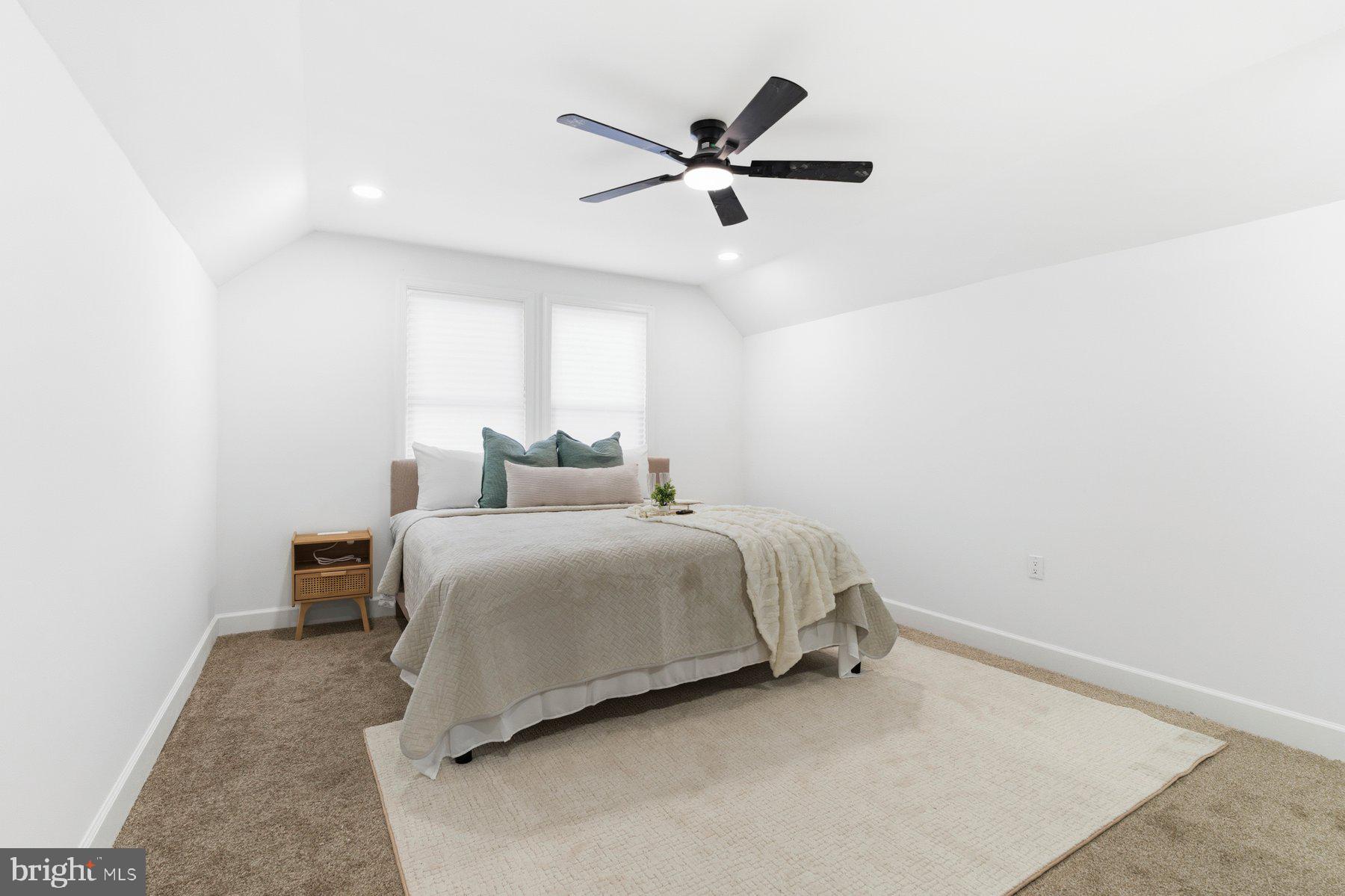 413 1st Avenue Halethorpe, MD 21227 - Photo 18 of 38 a bedroom with a bed and window