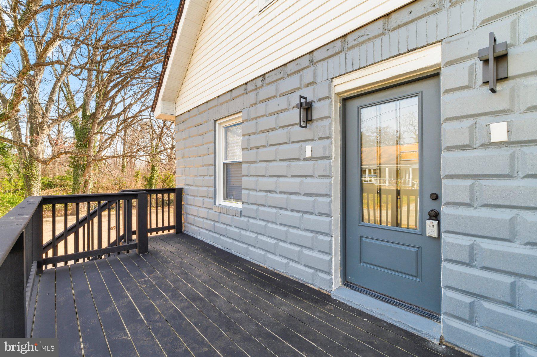 413 1st Avenue Halethorpe, MD 21227 - Photo 2 of 38 a view of a house with a wooden deck