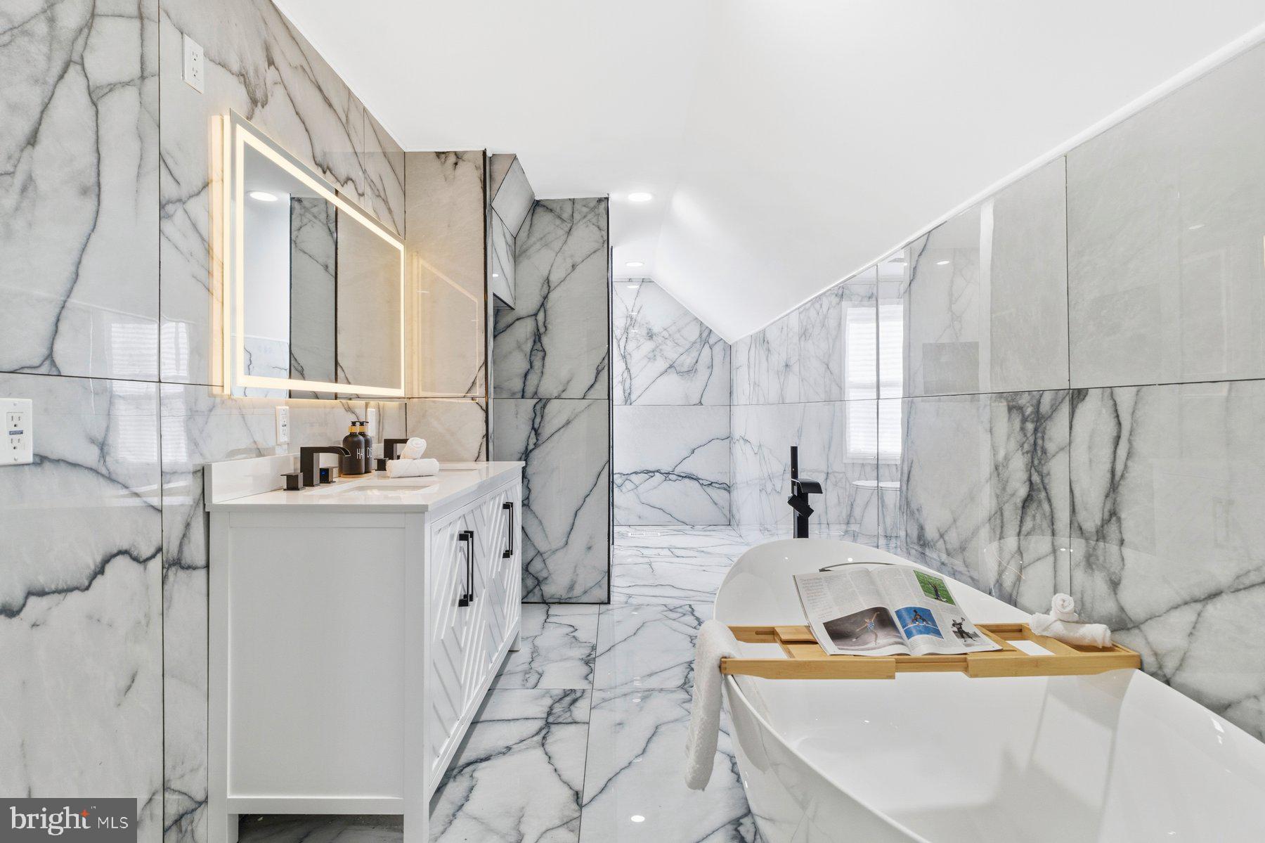 413 1st Avenue Halethorpe, MD 21227 - Photo 20 of 38 a bathroom with a tub sink and mirror