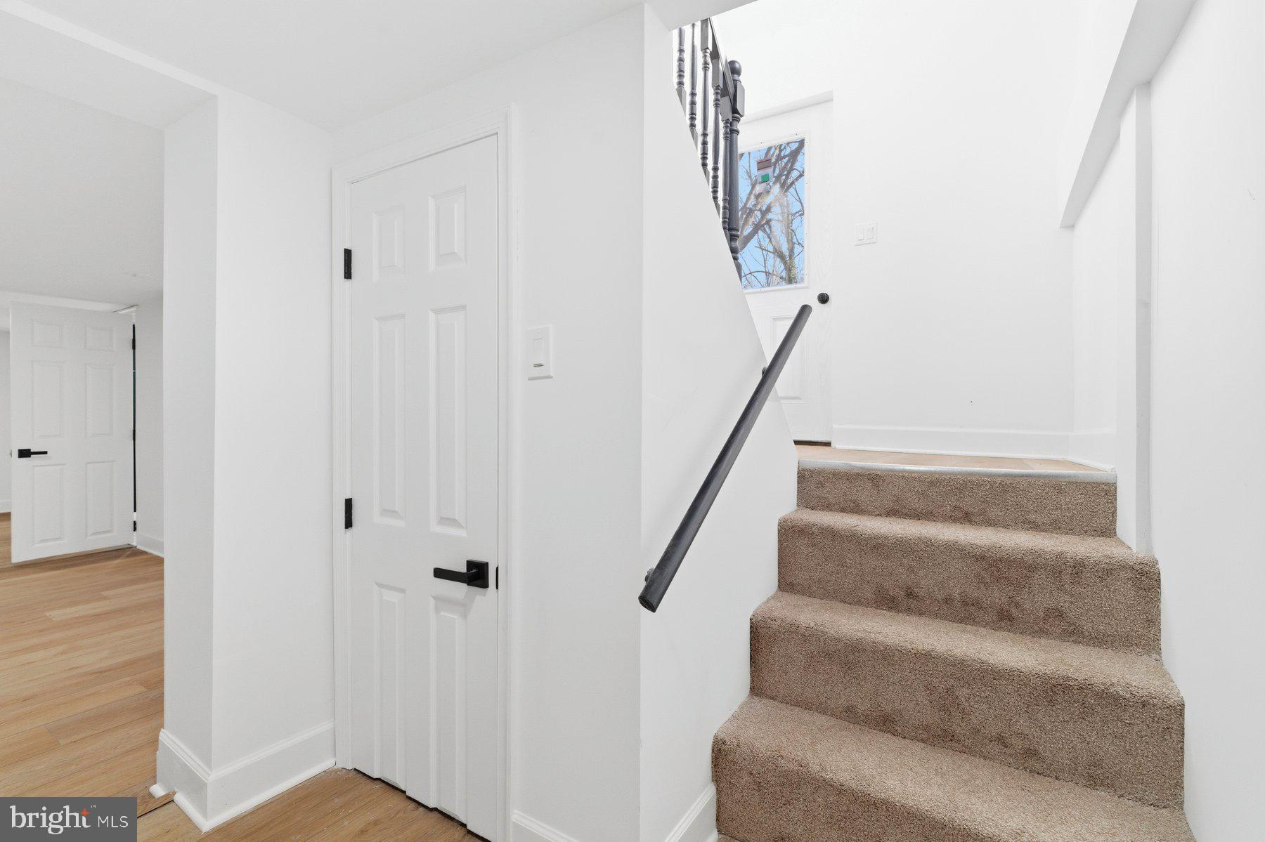 413 1st Avenue Halethorpe, MD 21227 - Photo 25 of 38 a view of staircase with white walls