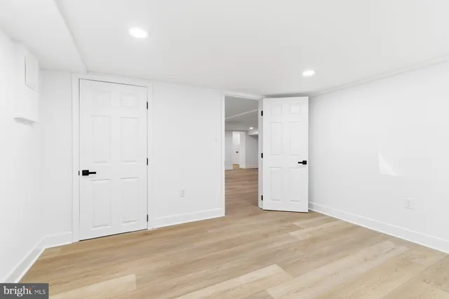 a bathroom with a sink shower and a mirror